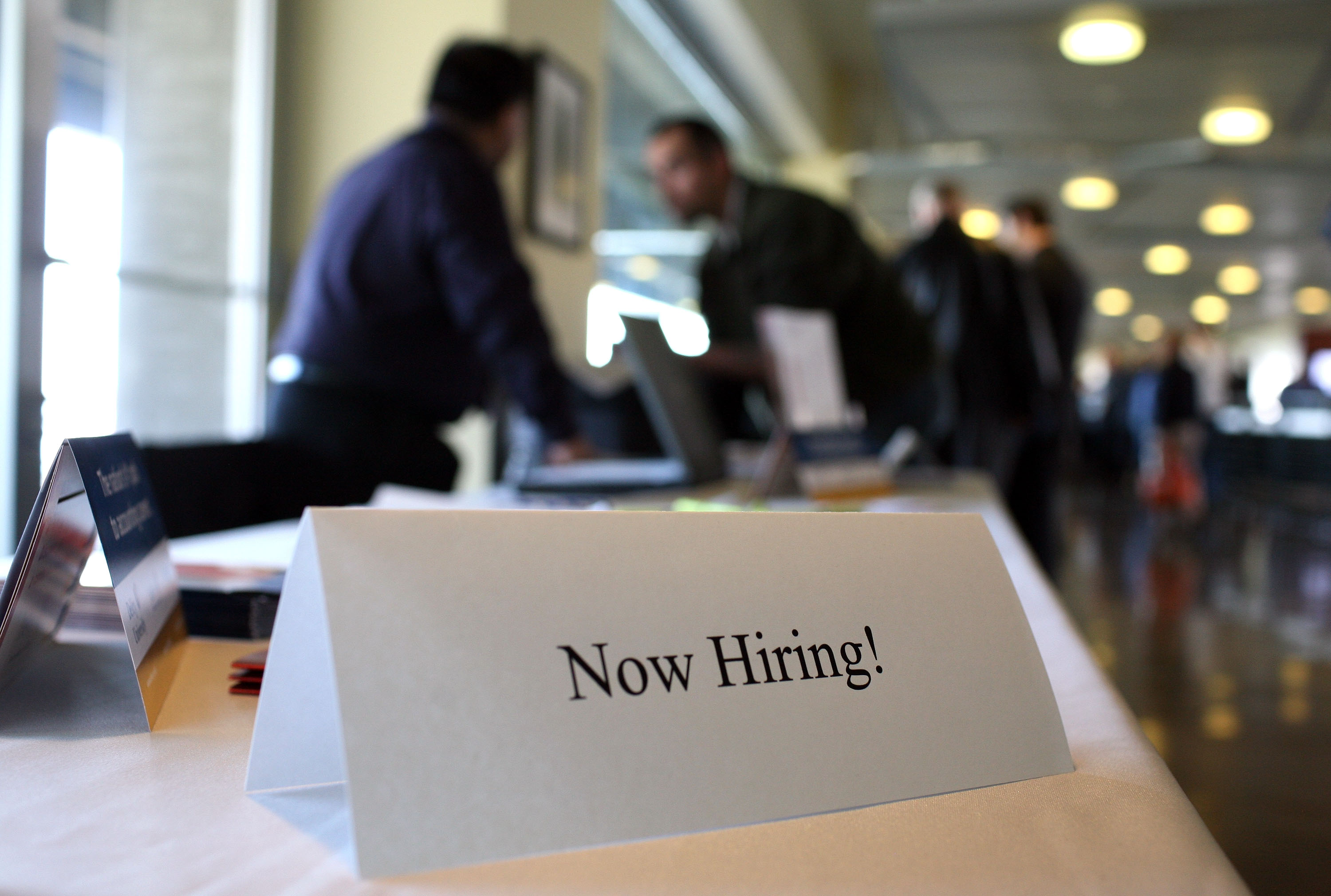 SAN FRANCISCO - MARCH 19: A "now hiring" sign is posted on a table during the Recruit Military Career Fair March 19, 2009 at AT&T Park in San Francisco, California. Hundreds of military veterans attended the career fair that was open only to veterans. (Photo by Justin Sullivan/Getty Images)